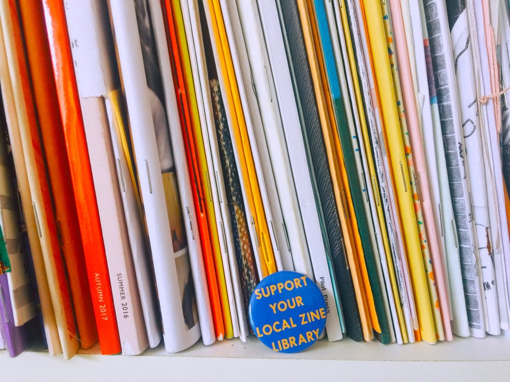 ✎ Help Us: Support Zine Library/Community space fund    SZL (support zine library) is our small funding project that contributes towards zine library and other community space fund raising, to help them purchase equipment for storing, shelving, archiving, workshops and improving accessibility. All funds from purchasing this badge will go towards our chosen zine library of the month. To apply please email: tenderhandspress@gmail.com